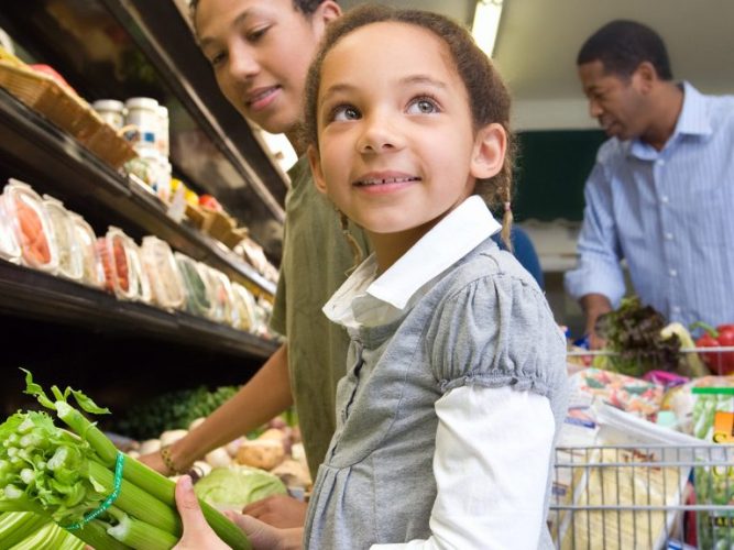 A family shopping at the grocery store.