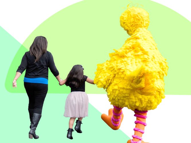 A parent, child and Big bird skipping away.