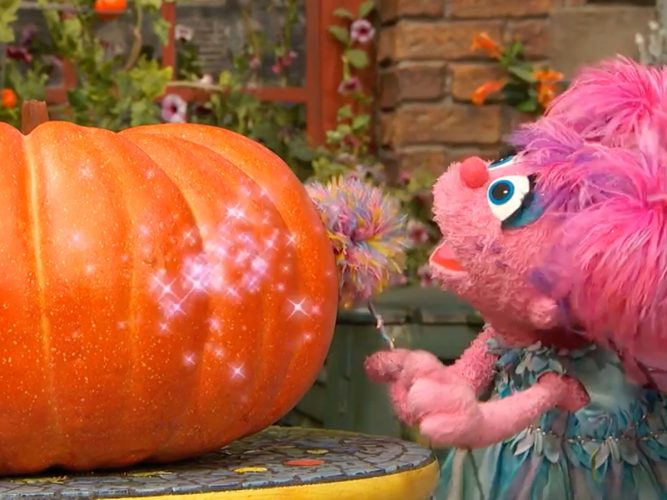 Abby and a pumpkin.