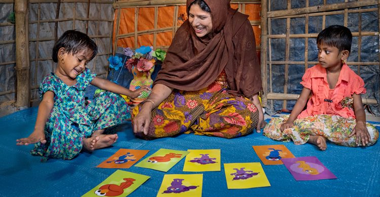 Children learning with a teacher.