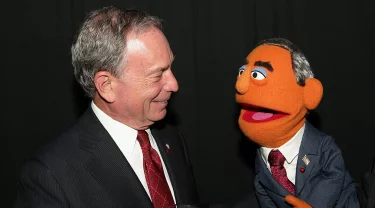 Michael Bloomberg and a puppet version of Michael Bloomberg.