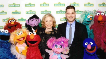 Joan Ganz Cooney, Michale Buble and the Muppets of Sesame Street.