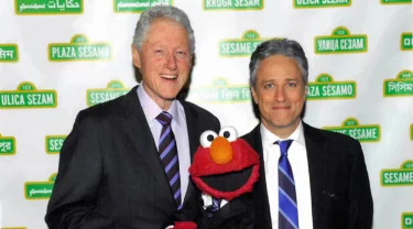 Bill Clinton, John Stewart and Elmo.