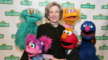 Joan Ganz Cooney with Rosita, Elmo, Abby, Zoe and Grover.