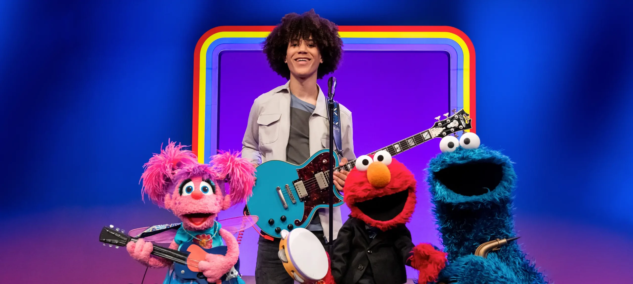 Elmo, Cookie Monster and Abby playing music