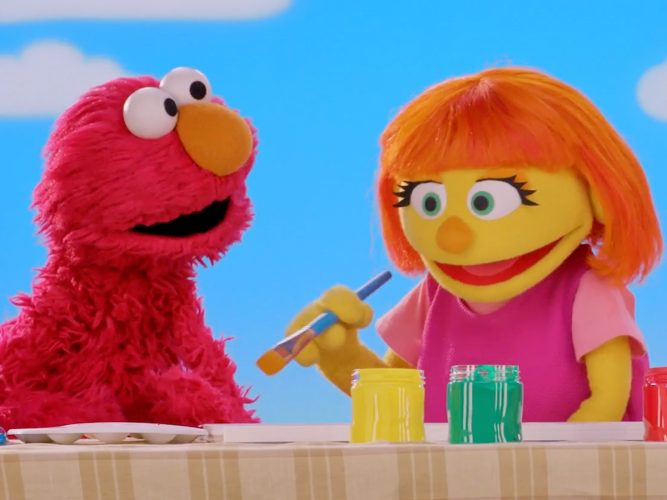 Julia paints with Elmo