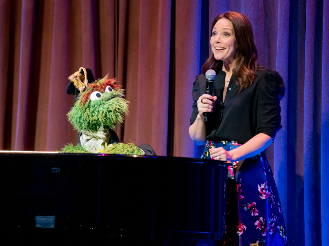 Erica Hill and Oscar the Grouch.