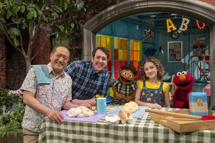 Tamir, Elmo, Alan and Charlie learning how to make challah.