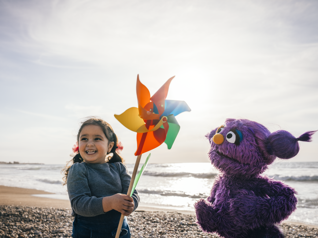 Basma and a child on the beach.