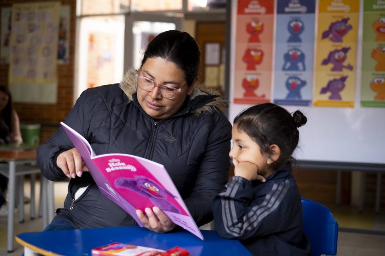 Woman reading to a child.