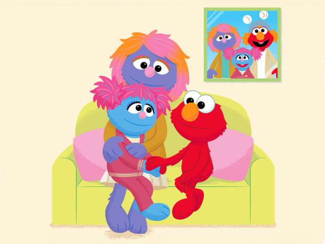 Elmo sitting with a caregiver and a child on a sofa.