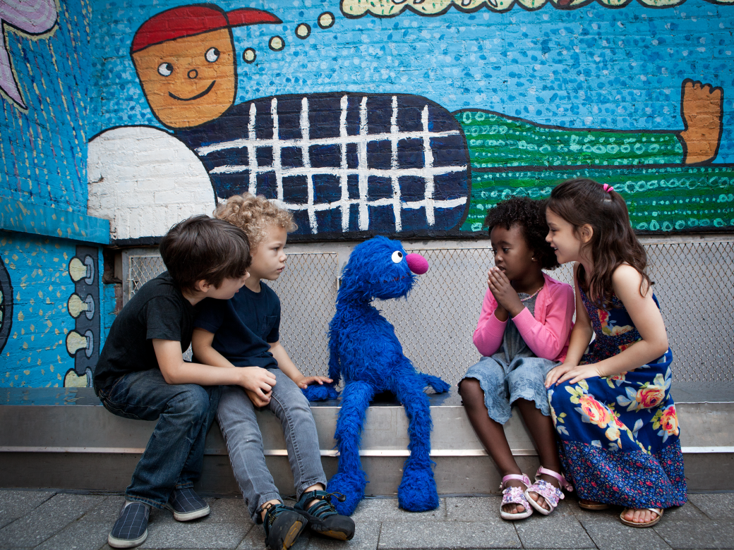 Grover talking to children.