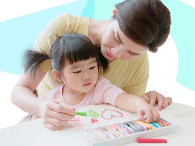 A parent helps their child color