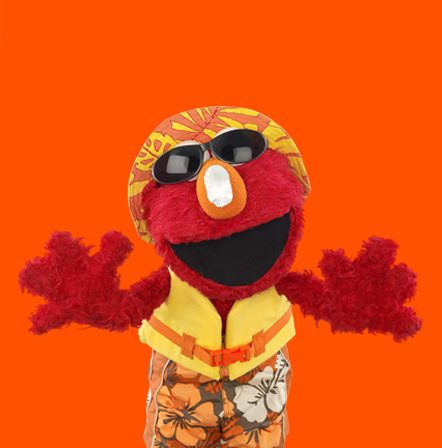 Elmo with sunscreen and a summer outfit