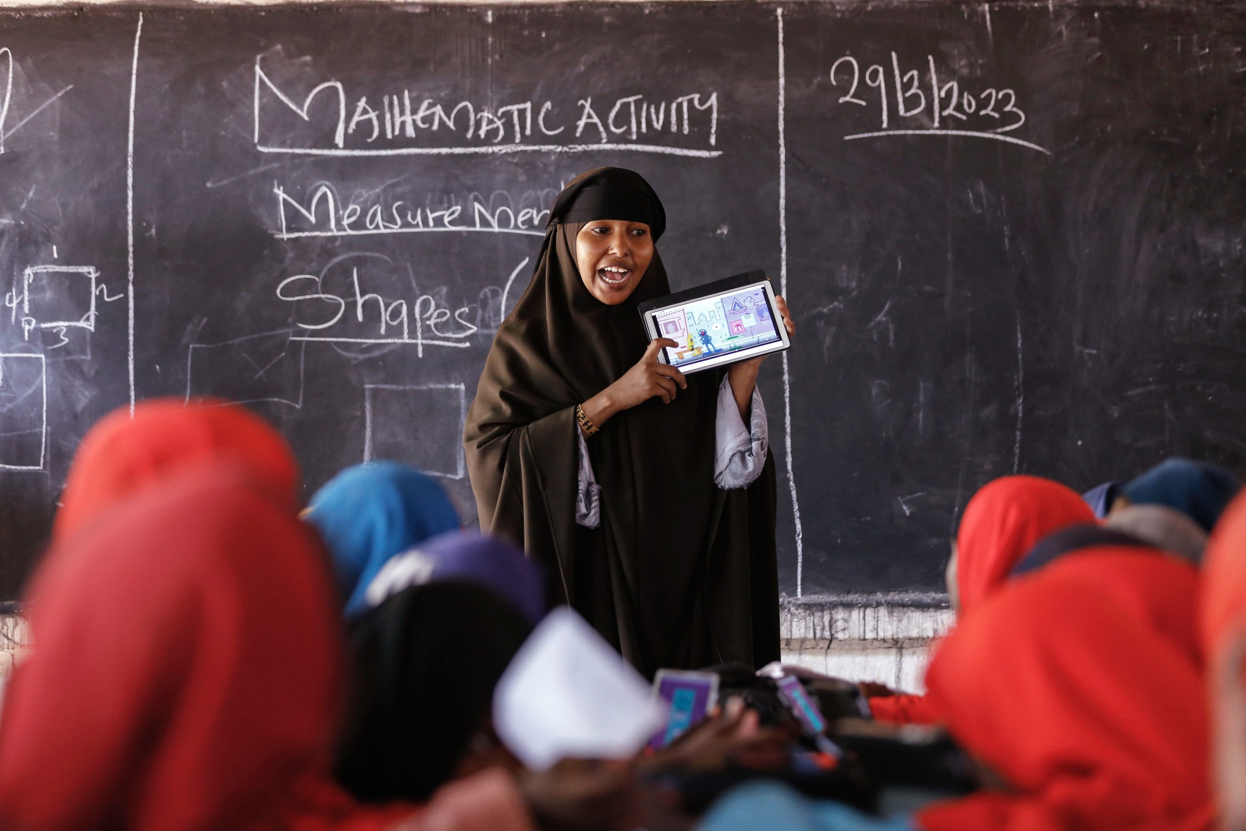 Woman reading to children