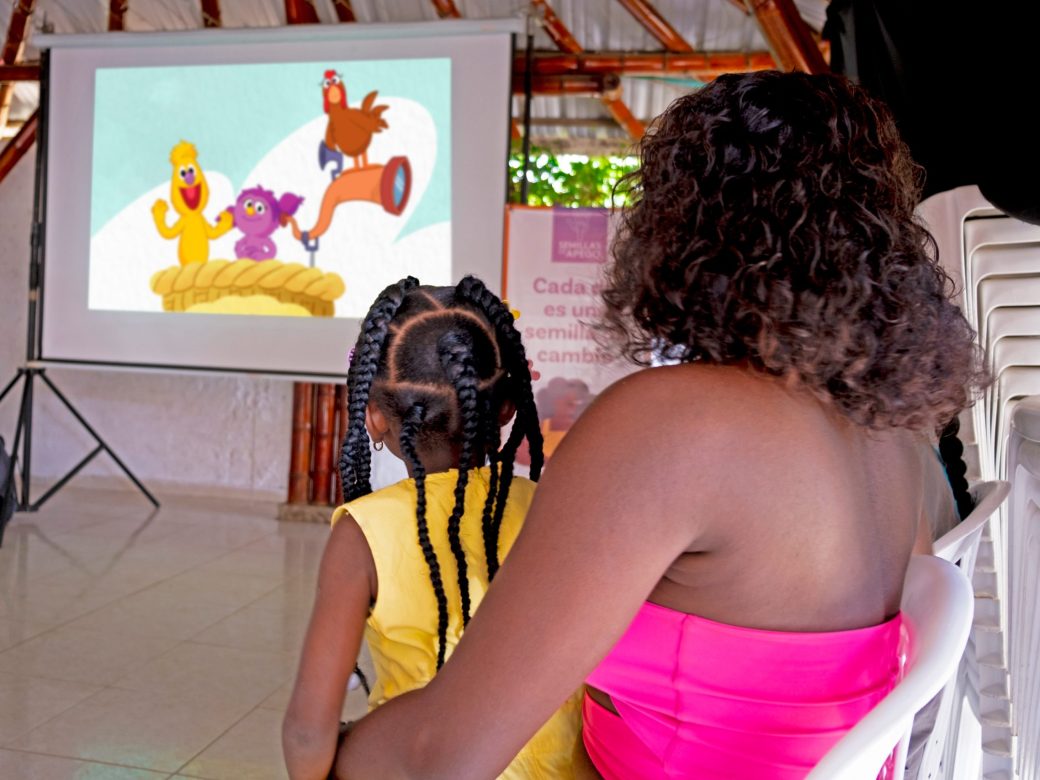 Woman and child viewing Watch, Play, Learn