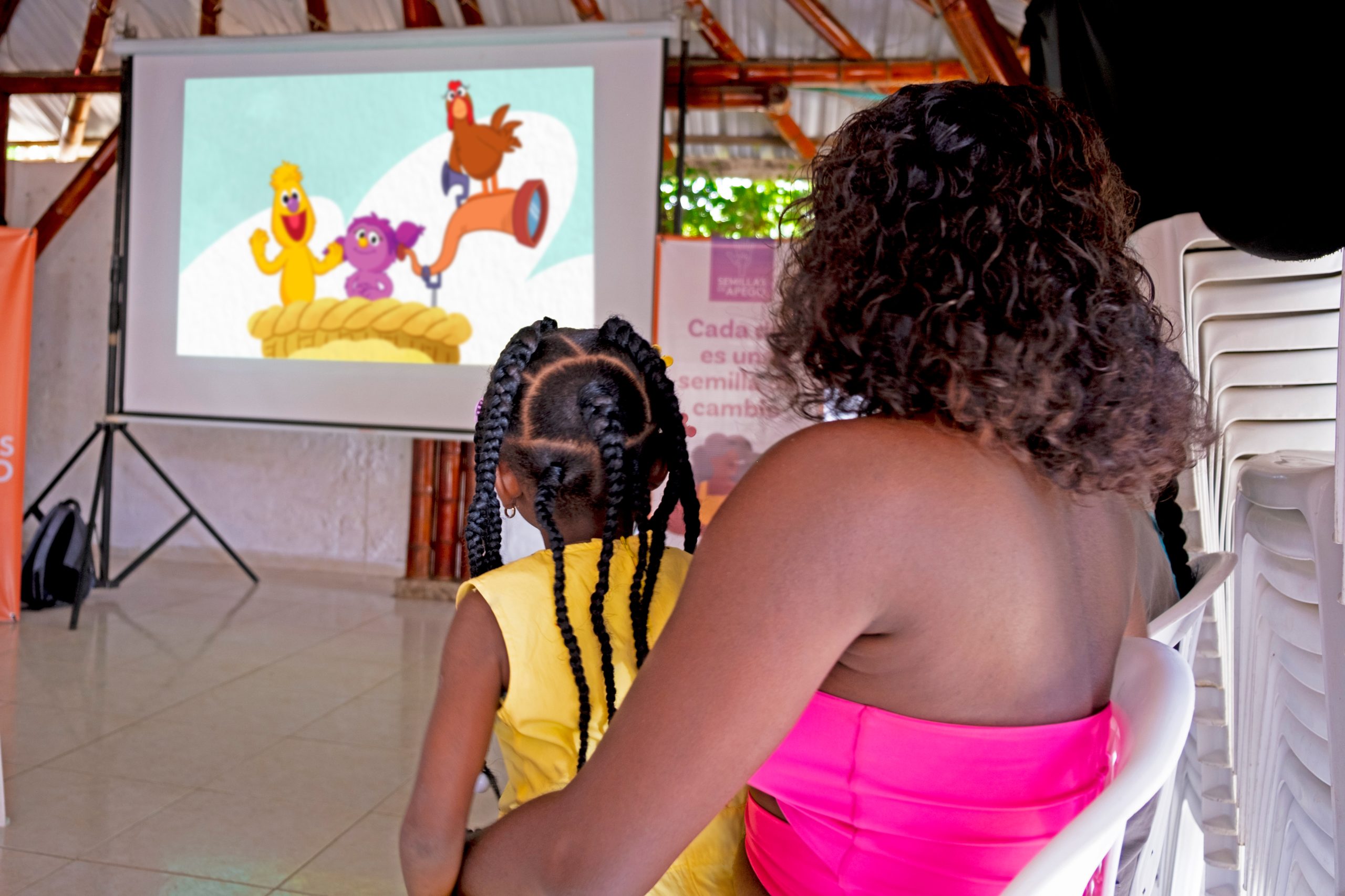 Woman and child viewing Watch, Play, Learn