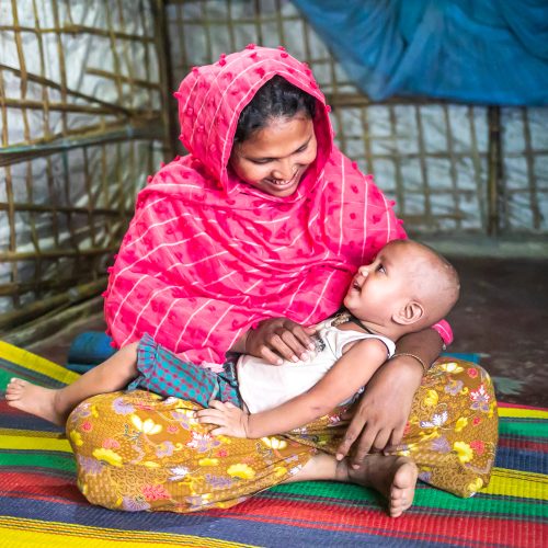 Parent playing with their child.