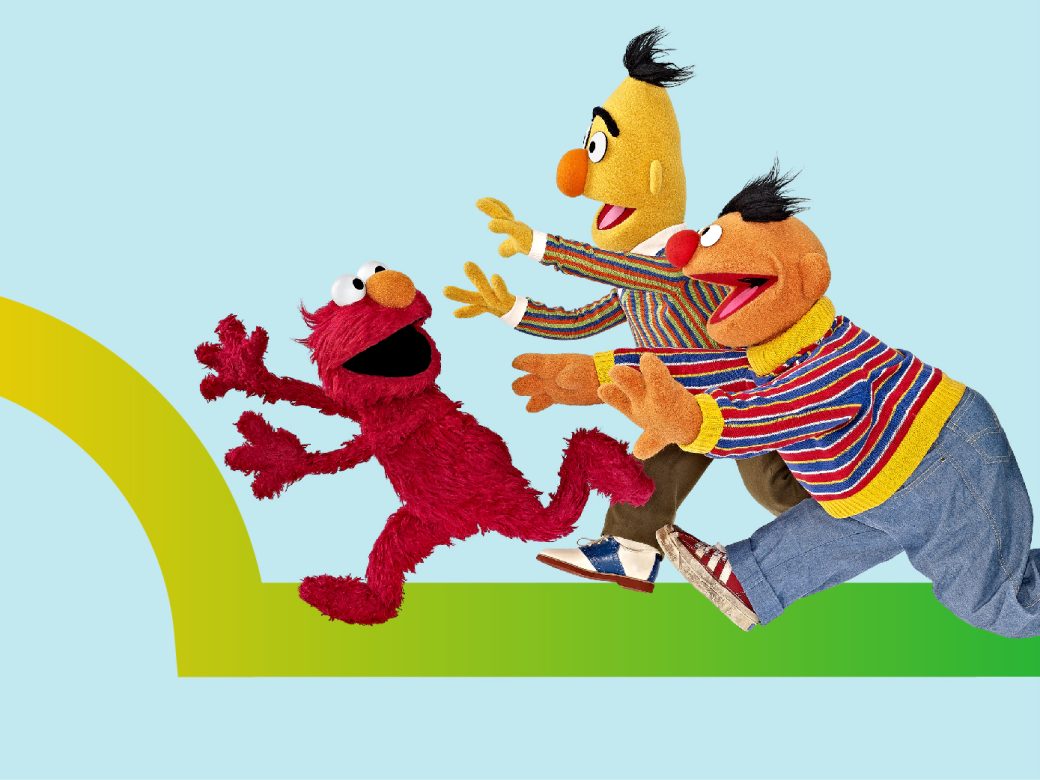 Elmo, Bert and Ernie running.