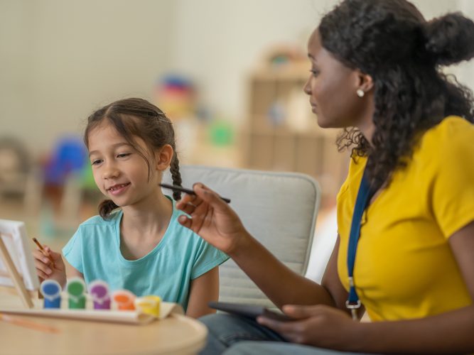 A provider paints with a child