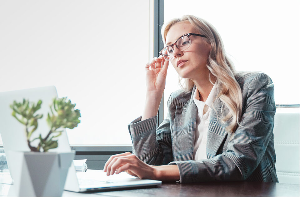 A woman is working with a computer