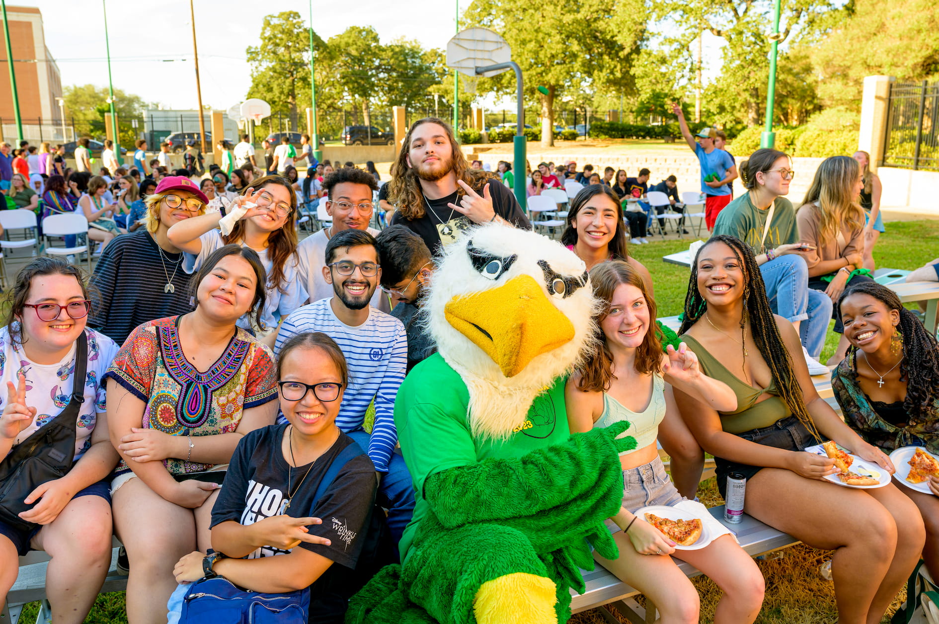 students at event posing with scrappy