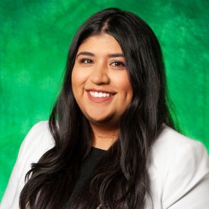 Desiree Padron Posing For A Headshot Photo