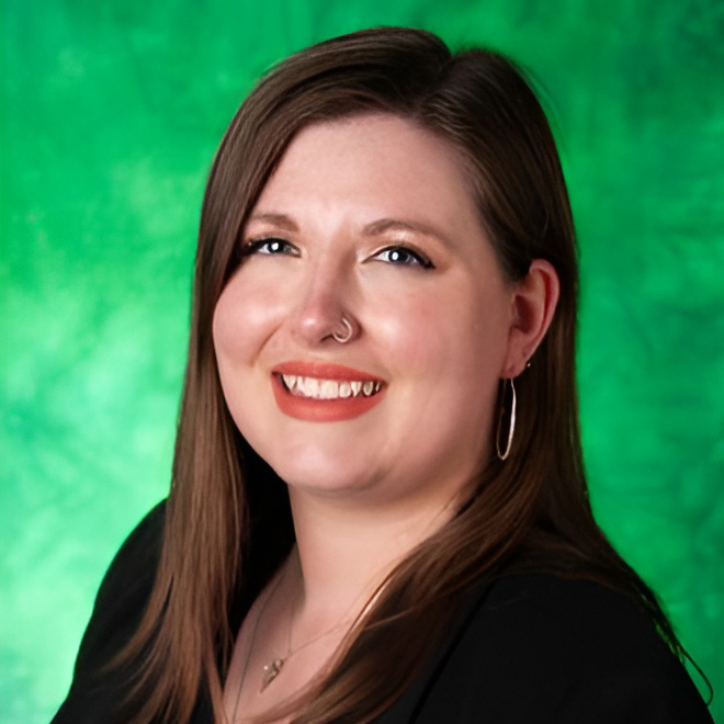 Victoria Schofield Posing For A Headshot Photo