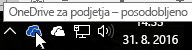 Posnetek zaslona prikazuje kazalec na modri ikoni storitve OneDrive z besedilom OneDrive za podjetja.