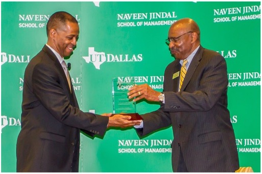 A man receiving an award.