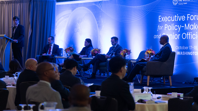 four panelists on stage speaking