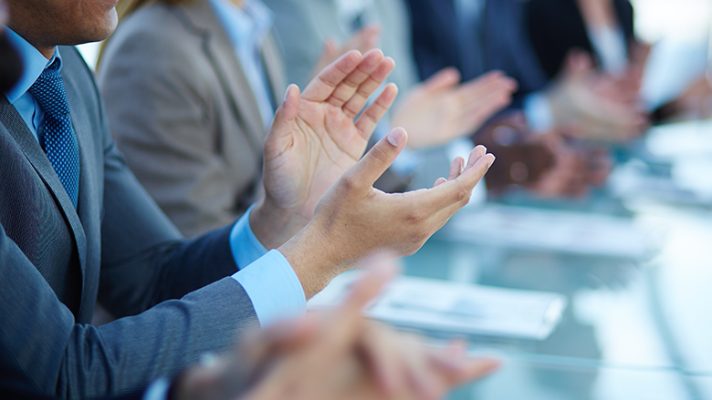 four pairs of hands clapping