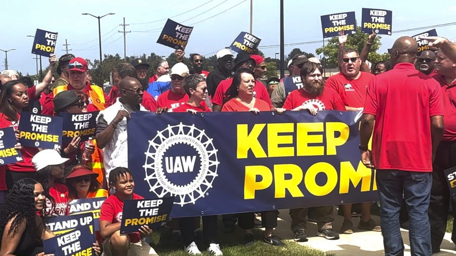 In this image from video, United Auto Workers members rally outside Stellantis' Sterling Heights Assembly Plant Friday, Aug. 23, 2024, in Sterling Heights.