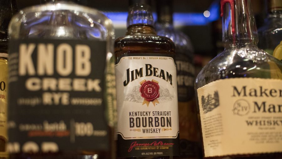 FILE - Jim Beam, Knob Creek and other alcohol bottles are pictured at a bar in Eagle, Colo., Dec. 25, 2018.