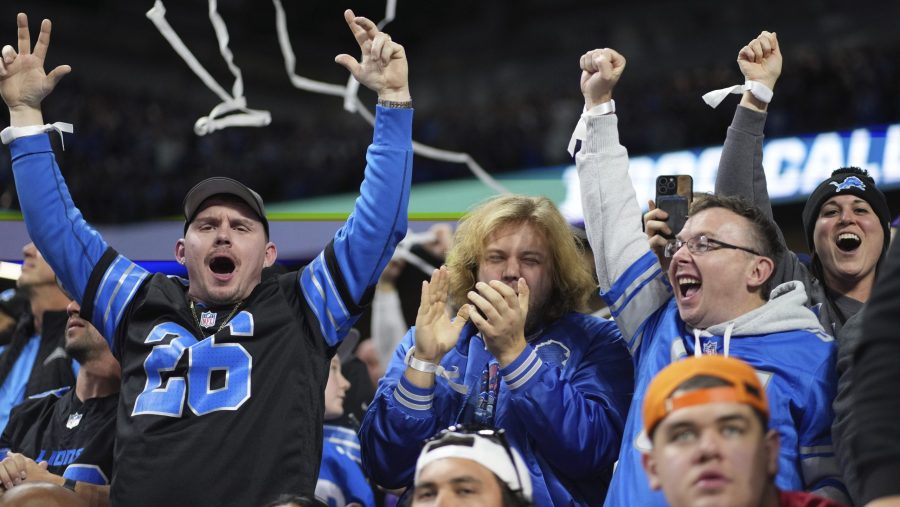 Detroit Lions fans celebrate a touchdown during the second half of an NFL football game between the Detroit Lions and the Minnesota Vikings, Sunday, Jan. 5, 2025, in Detroit.