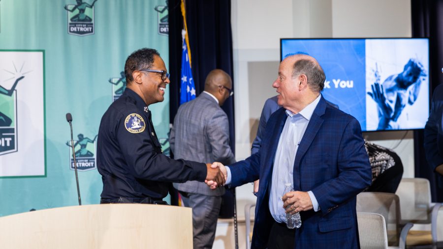 Detroit Police Chief Todd Bettison and Mayor Mike Duggan shake hands at a press conference