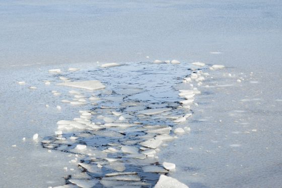 Thin, unsafe ice over a lake. 