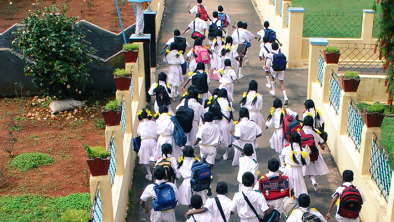 Students coming out from a school in India  (Aerial view) | Image Credit: Picxy.com/DREAMWORKS 