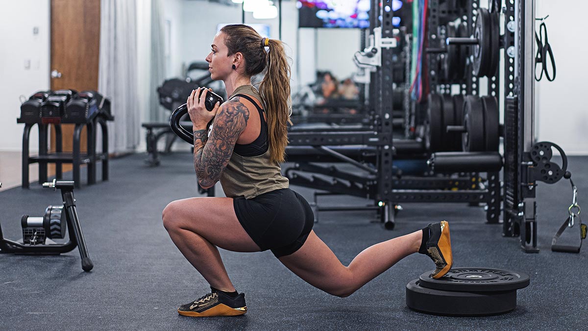 Female Strength Training Athlete Performing Bulgarian Split Squat