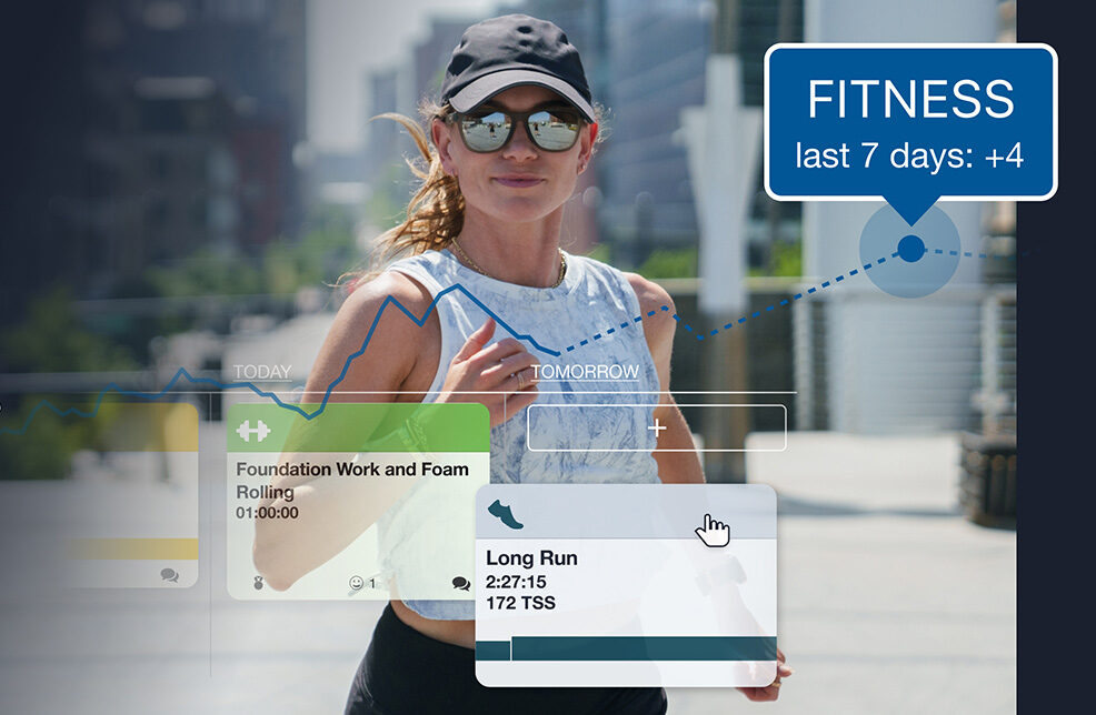 Female Athlete Running In Downtown Denver, Co Using Trainingpeaks.