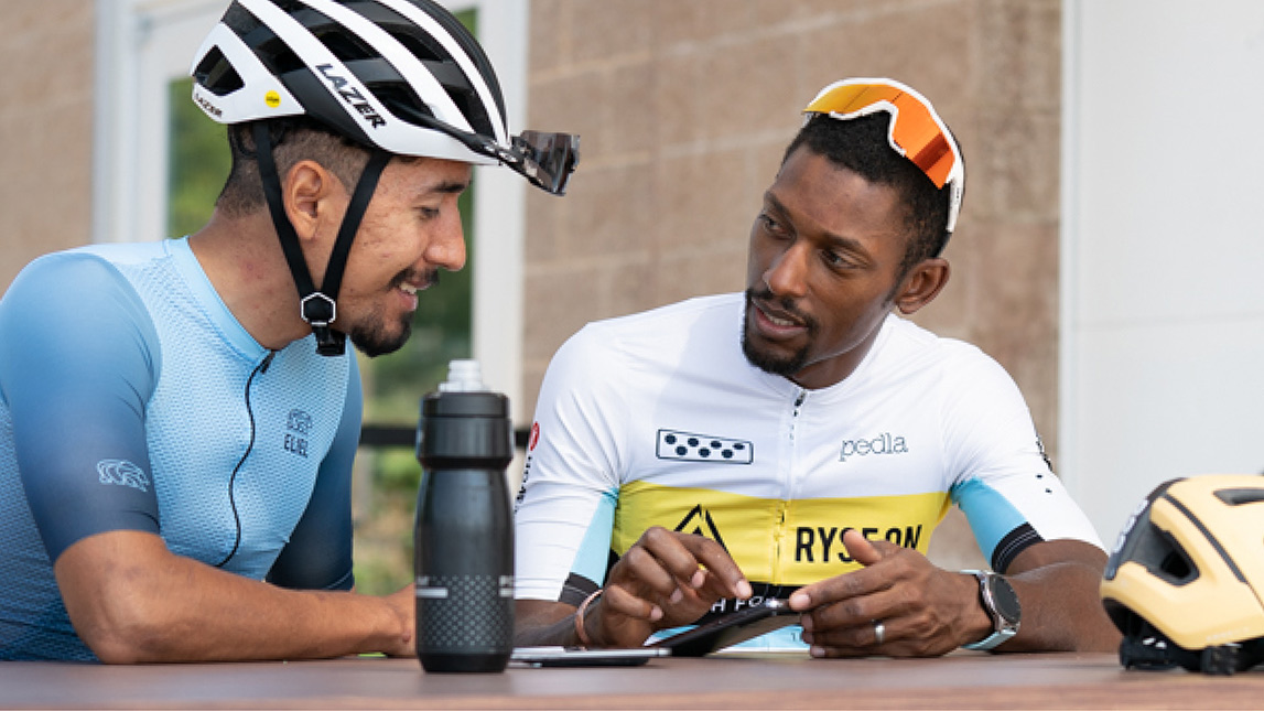 Coach Showing Male Cyclist How To Train With Trainingpeaks.