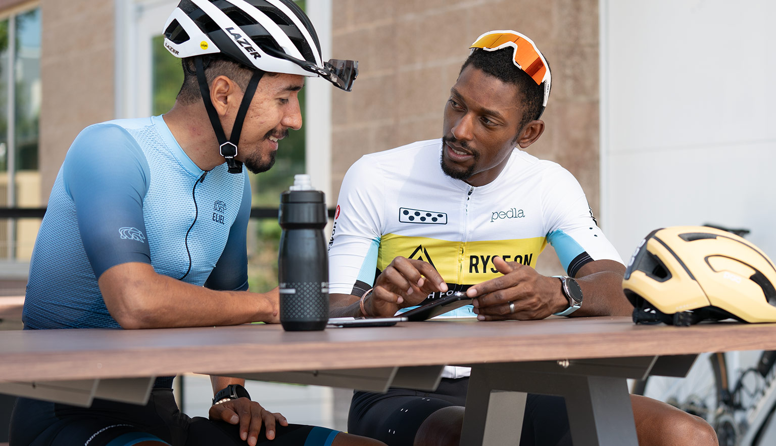 Coach Showing Male Cyclist How To Train With Trainingpeaks.