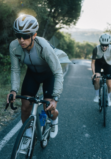 Cyclists Riding On Road