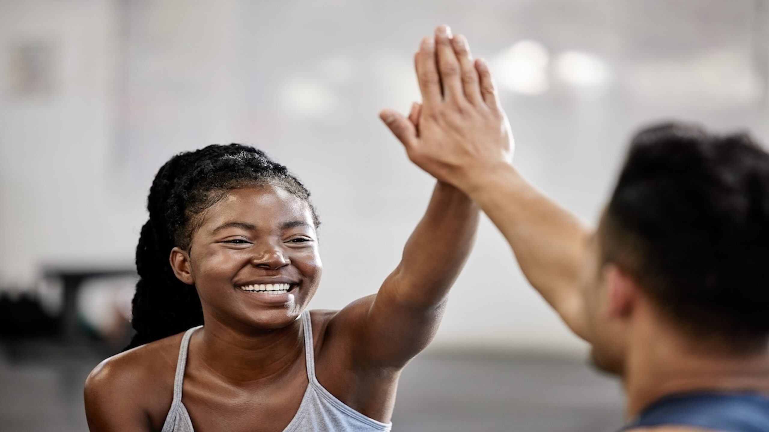 High Five, Fitness Team And Gym Success Of Friends In Happy Exercise Workout Together For Health And Wellness. Black Woman With Smile, Excited And Goal In Teamwork Celebration With Her Training Coach