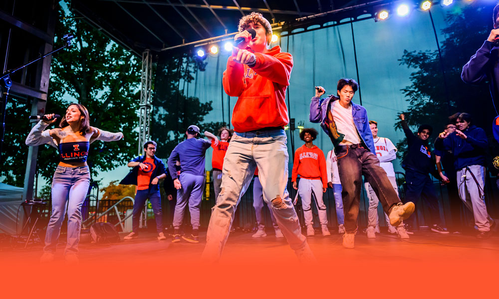 students gather for a Homecoming pep rally at Grange Grove which included free food, games, and music