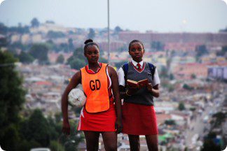 An image of two students, an athlete and a scholar