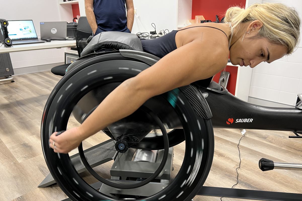 Madison de Rozario testing out her wheelchair with AIS Engineering