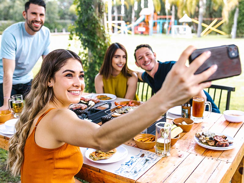 Group of friends having a BBQ