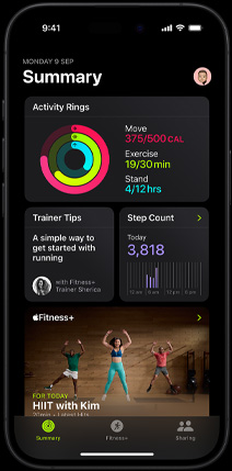 Summary tab screen in the Fitness app showing Activity rings, Trainer Tips, Step Count and recommended Fitness+ workouts on iPhone