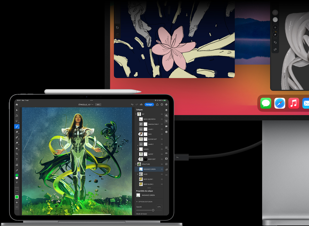 iPad Pro fixé à un Magic Keyboard en orientation paysage, connecté à un moniteur externe, des images sont retouchées sur les deux écrans